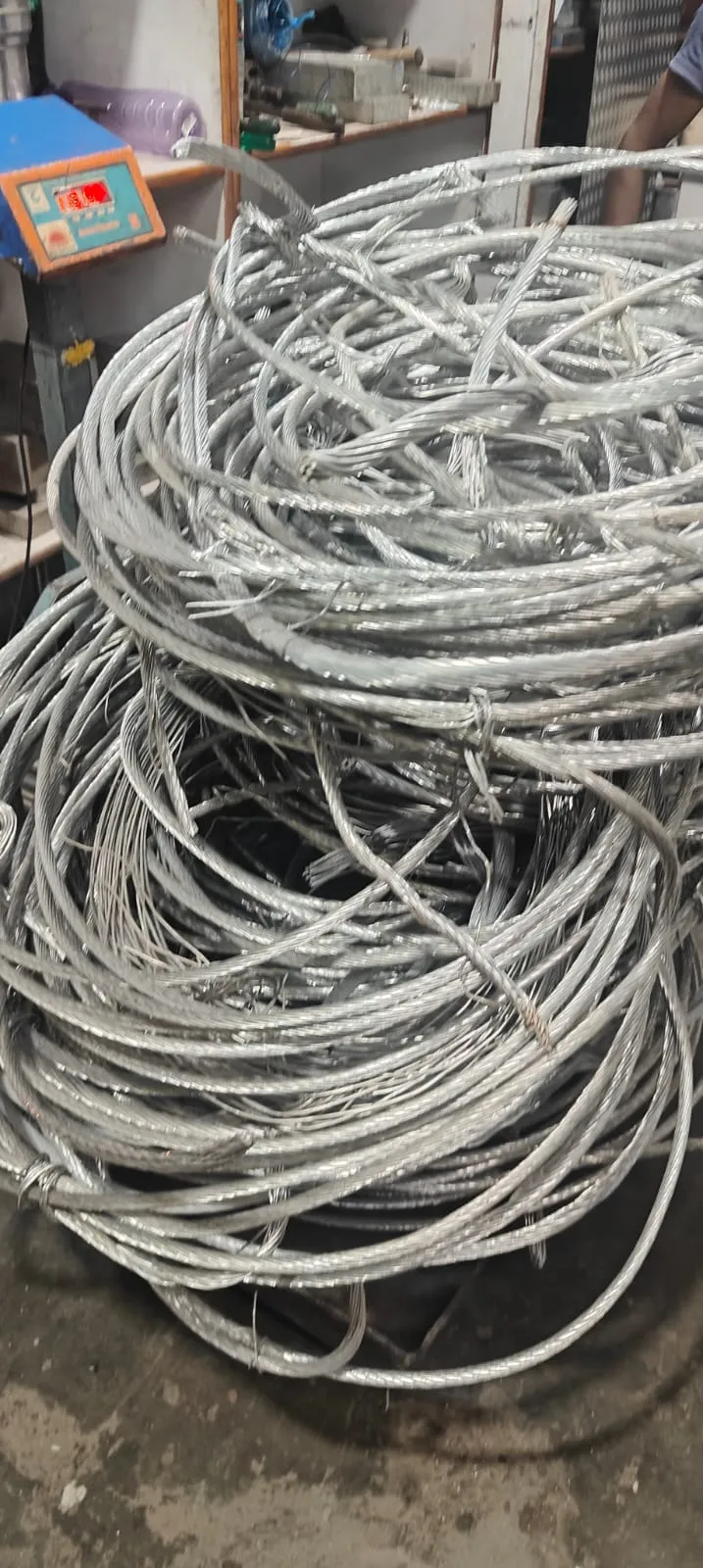 Aluminium scrap buyers in Bangalore — Urban Eco Recyclers weighing aluminium extrusion and section scrap on a digital scale