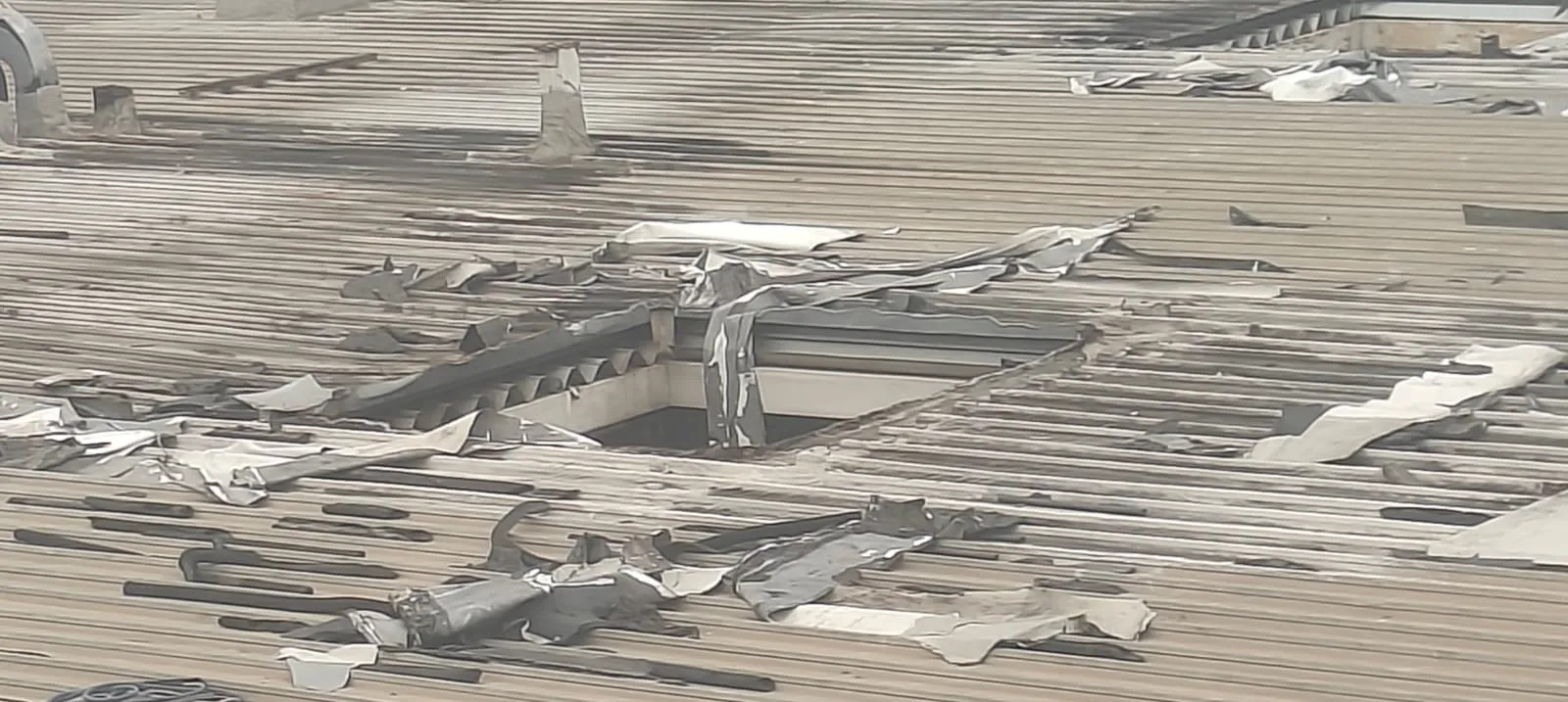 Industrial demolition services in Bangalore — Urban Eco Recyclers heavy crane and excavator dismantling a factory structure