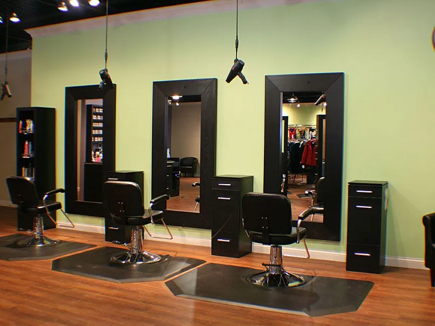 Salon and spa dismantling services in Bangalore — Urban Eco Recyclers crew removing styling chairs, mirrors and spa tubs from a beauty parlor interior