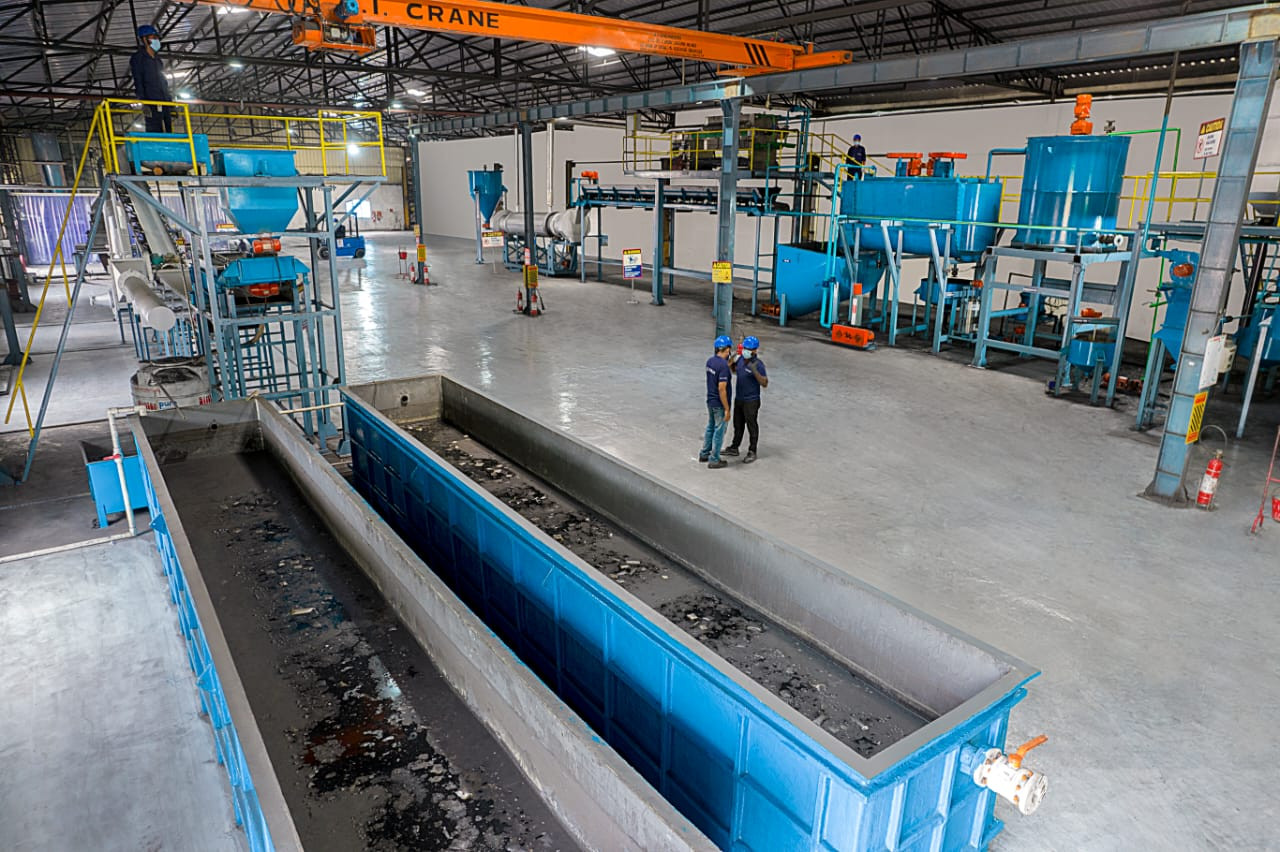 Automated machinery operating inside eco-friendly battery recycling plant