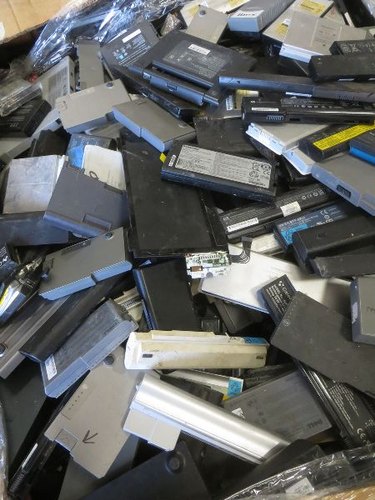 Bulk lithium-ion laptop battery scrap collected for certified green recycling in Bangalore