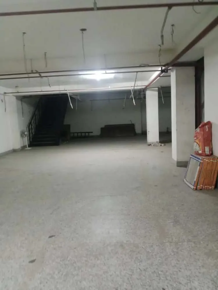Commercial gym strip out Bangalore — heavy gym equipment removal and rubber flooring disposal in progress