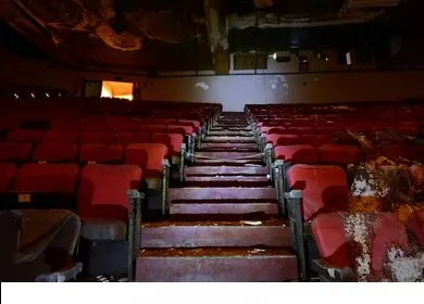 Cinema hall demolition services Bangalore — push back seat removal and acoustic panel dismantling in progress