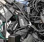 Corporate Office Waste Management– Best Practices Tangled pile of old electronic scrap power adapters, laptop chargers, and black cables collected by scrap dealers in Bangalore