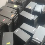 Old Computer Buyer in Bangalore A pile of decommissioned Lenovo desktop computer CPU towers gathered on an office floor for e-waste recycling in Bangalore.