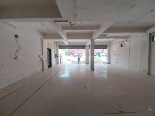 Retail shop demolition Bangalore — false ceiling removal and glass partition dismantling in progress
