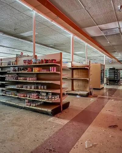 Retail mart demolition Bangalore — heavy duty display racks removal and commercial chiller disposal in progress